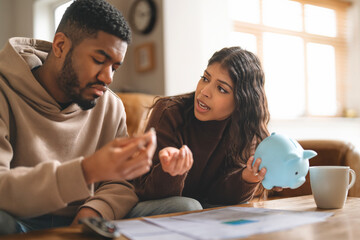 Couple discusses financial planning while sitting at home during the afternoon