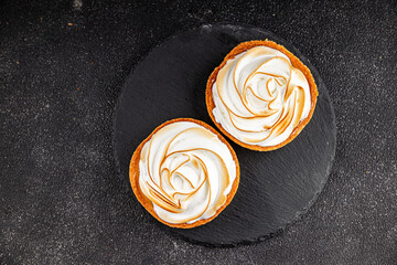 Lemon tart sweet dessert meringue, lemon curd, shortcrust pastry tasty fresh delicious gourmet food...