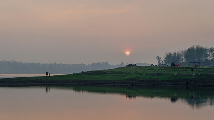 enjoying the sunrise on the river bank