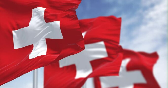 Close-up of Switzerland national flags waving in the wind