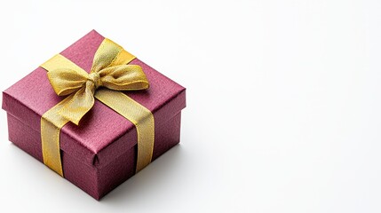 Beautifully wrapped present box with a decorative bow and gold ribbon for gifting on special occasions and celebrations