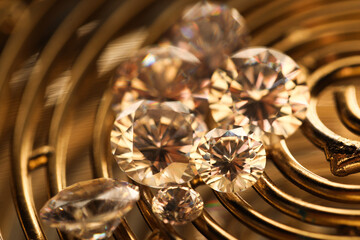 Beautiful shiny gemstones on golden tray, closeup