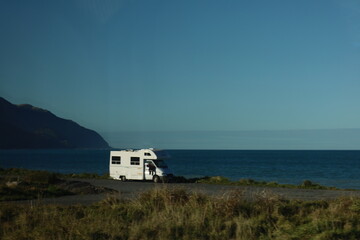 Camper Van Parked by the Sea – Coastal Travel Adventure