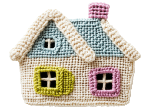 Decorative crochet house with colorful window accents displayed in a bright setting