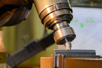 The angular milling process on NC milling machine with chamfer tools.