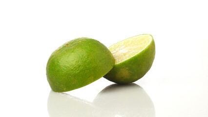 Lime Fruit Cut in Half Isolated in White Background With Vibrant Green Skin and Juicy Interior