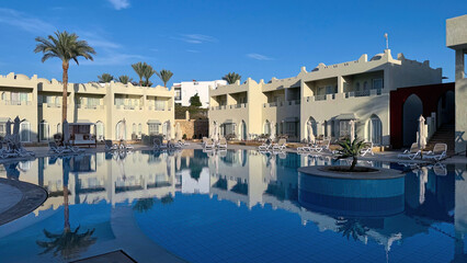 Beautiful empty swimming pool area in luxury resort town, Egypt.