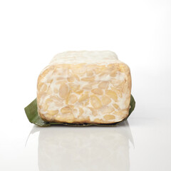 Tempeh Block Isolated in White Background Showcasing Texture and Color Variation
