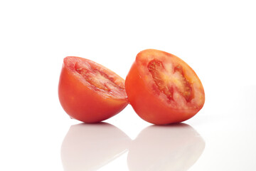Isolated in White Background, Two Halved Ripe Tomatoes Displaying Vibrant Red Color and Fresh Interior Details