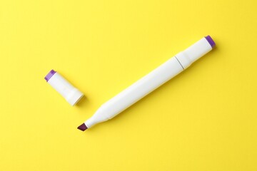 One color double sided marker on yellow background, top view