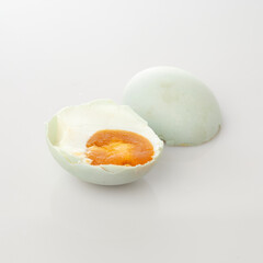 Egg Isolated in White Background Showcasing Its Cracked Shell and Yolk