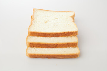 Isolated in White Background, Sliced Bread Stacked in a Neat Arrangement Showcasing Soft Texture...