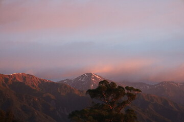 Distant Snowy Mountains at Sunrise – Breathtaking Natural Landscape