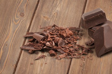 Dark sweet tasty chocolate bar on table