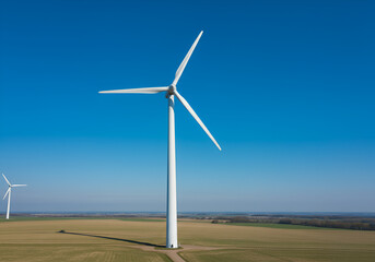 Wind turbine against a blue sky: Sustainability and clean energy, timeless for eco-friendly campaigns.