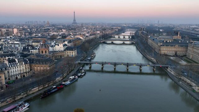 drone flying above the Seine river in Paris at sunrise, Cite island, morning aerial view of Paris, capital of France, French tourism