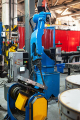 Fototapeta premium Automatic Industrial welding robot in a modern factory in operation.
