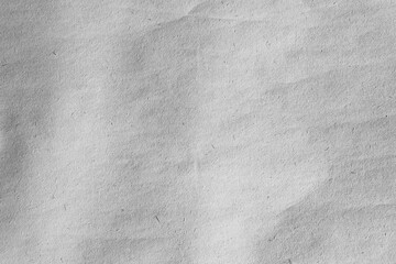 Dark grey crumpled kraft background paper texture
