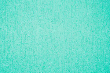 Textured decorative plaster pattern in bright turquoise for stylish wall finishing in interiors