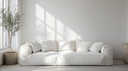 A white cozy soft sofa sits in a living room designed with warm minimalism and wabi-sabi style.