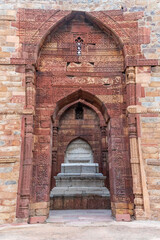 Fototapeta premium The Tomb of Sultan Shamsuddin Iltutmish in Delhi’s Qutub Minar Complex is part of a historic site featuring the world’s tallest brick minaret at 72.5 meters.
