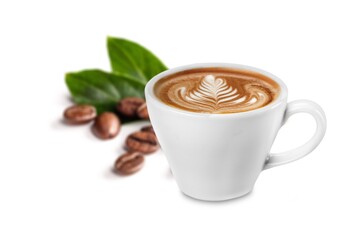 Cup of tasty hot coffee and coffee beans on desk