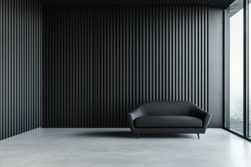 A dark gray sofa against a matte black wall exudes luxury.