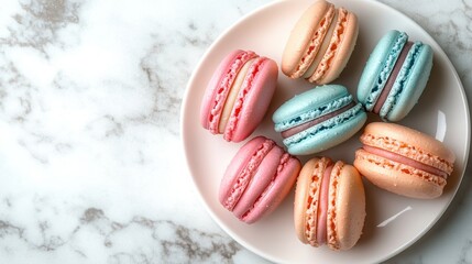 Top-down view of a plate filled with colorful macarons on a marble surface