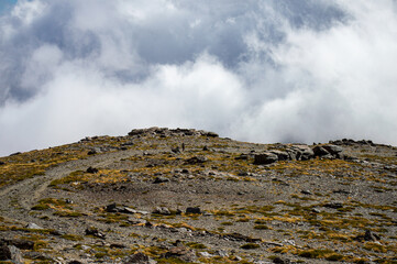Cloudy over mountains on hiking trail to Mulhacen peak, Sierra Nevada National park, Andalusia, Spain