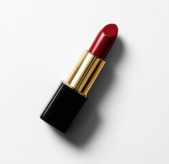Luxurious black and gold lipstick rests elegantly on a pristine white backdrop, its richly pigmented, slightly tilted ruby-red lip exuding allure and sophistication