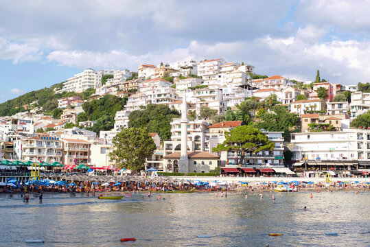 Ulcin, Montenegro - July, 2018: Montenegro beaches with a lot of people and sun umbrellas.