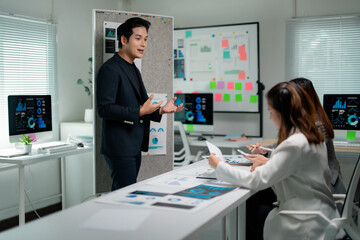 Professional analyzing business metrics during collaborative strategy session