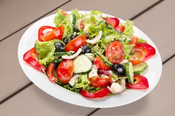 Fresh garden tasty salad with greens and vegetables