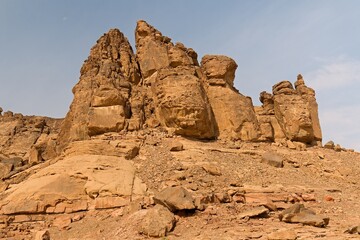 Fototapeta premium Jubbah Rock Formations in the Nafud Desert, featuring Neolithic art from the 7th to 2nd centuries BC. UNESCO World Heritage Site. Saudi Arabia.