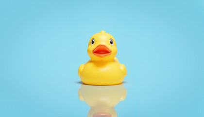 Bright yellow rubber duck on calm blue background, playful whimsy