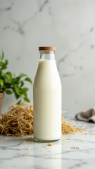 Handmade milk with A2A2 label inside a brown glass bottle next to dry grass.