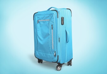 Colored classic suitcase on light background