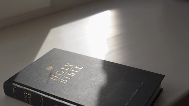 Holy bible in the rays of the sun. Christian biblical concept of wisdom from God Jesus Christ, the Gospel, studying and reading the Scriptures.