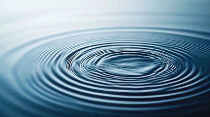 Water drop ripples on still surface, soft lighting, abstract background
