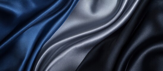 Obraz premium Elegant waves of blue and silver silk fabrics create luxurious texture
