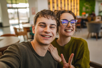 close up of hugged couple take smile and gesture in the cafe