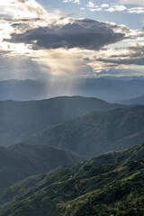 Obraz premium rain clouds in dark tones in the Andean mountain range of Colombia, a dramatic landscape scene. Powerful sunset lights and storm form.