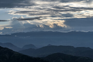 Rain clouds in dark tones in the Andean mountain range of Colombia, a dramatic landscape scene. Silhouette of mountains in the midst of a storm.