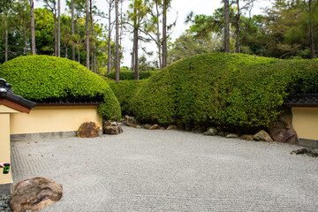Exploring a Japanese rock garden at the  Morikami Museum and Japanese Gardens in Delray Beach, Florida.