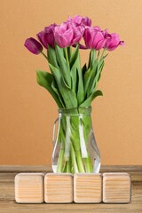 Creative Blogging Concept on Wooden Blocks and fresh flowers