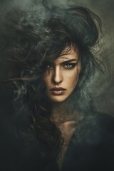 Fototapeta premium Close up portrait of a woman with dark, textured hair styled dramatically, partially obscuring her face. Moody, atmospheric lighting with dark, muted