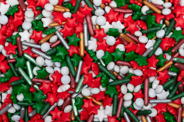 Christmas Sprinkles Background - Festive Holiday Baking Decorations with Red Stars, White Pearls, and Green Jimmies for Seasonal Confectionery and Desserts
