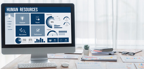 Human resources management software on computer screen helping human resources employee to manage recruitment, payroll, staff searching and KPI evaluation brisk