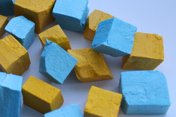 Paint for soy wax in the form of cubes, yellow 
paint, blue paint