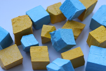 Paint for soy wax in the form of cubes, yellow 
paint, blue paint